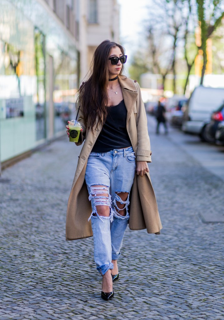 BERLIN, GERMANY - APRIL 22: Nadja Ali drinking a juice and wearing a beige Celine trench coat, a ripped denim jeans, a black top, black Celine sunglasses, black Saint Laurent heels on April 22, 2016 in Berlin, Germany. (Photo by Christian Vierig/Getty Images)