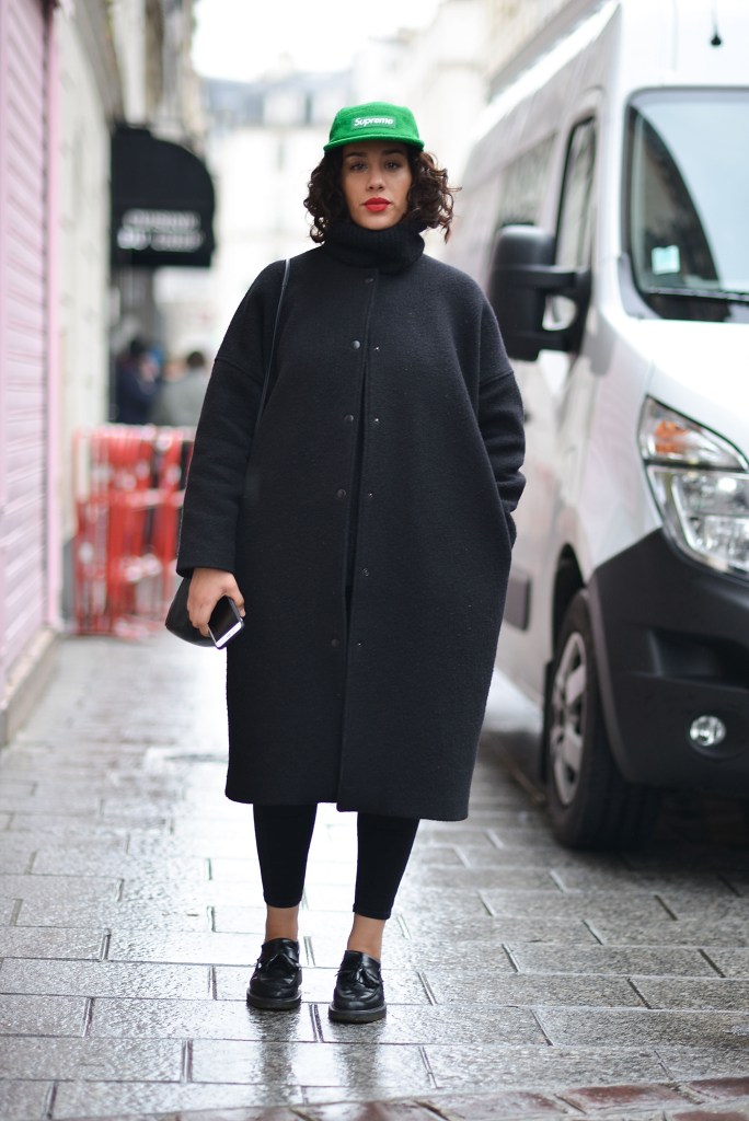 PARIS, FRANCE - MARCH 01: A guest poses wearing a Supreme cap after the Aalto show at the Espace Commines during Paris Fashion Week Fall/Winter 16/17 on March 1, 2016 in Paris, France. (Photo by Vanni Bassetti/Getty Images)