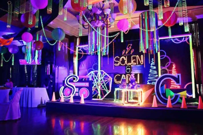 A room decorated with glow in the dark and neon part decor