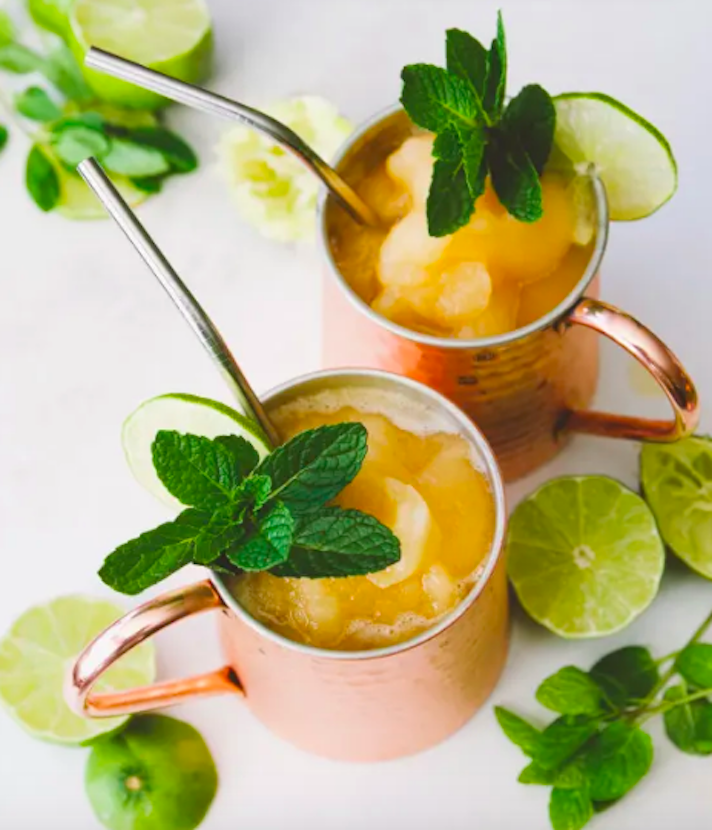 STYLECASTER | 17 Easy Blender Cocktails That Make Any Day Feel Like Vacation | Peach Bourbon Mule