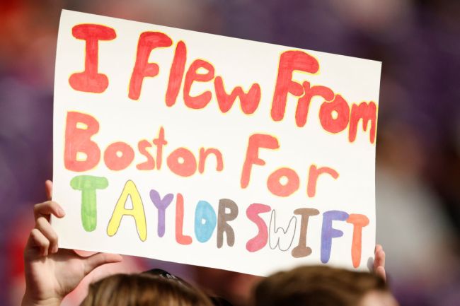 A fan holds up a sign in reference to Taylor Swift prior to a game between the Kansas City Chiefs and the Minnesota Vikings
