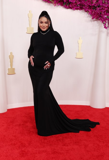 Vanessa Hudgens in a black turtleneck maternity evening gown at the 2024 Oscars red carpet