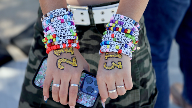 Taylor Swift fan wearing friendship bracelets at Eras Tour.