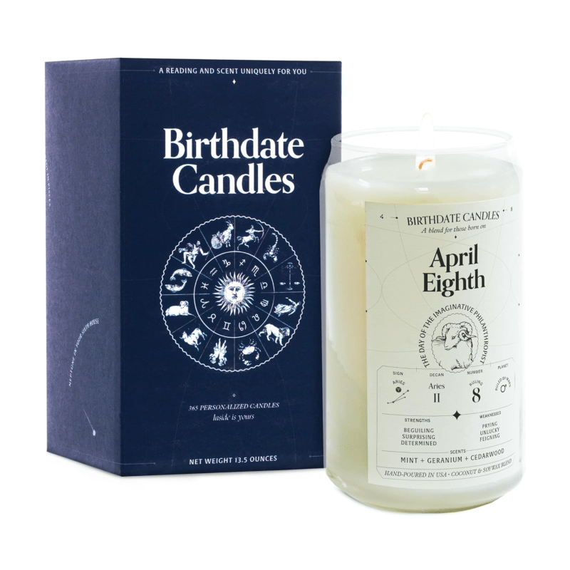 An April Eighth candle with an astrological label, next to its box