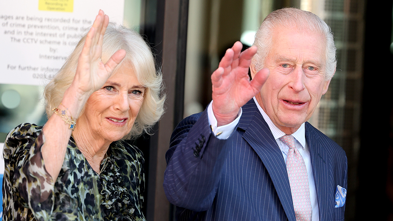 King Charles III and Queen Camilla wave as they arrive at the University College Hospital Macmillan Cancer Centre on April 30, 2024 in London, England. This visit raises awareness of the importance of early diagnosis and will highlight some of the innovative research, supported by Cancer Research UK, which is taking place at the hospital. The visit also marks His Majesty’s first day as the new Patron of Cancer Research UK.
