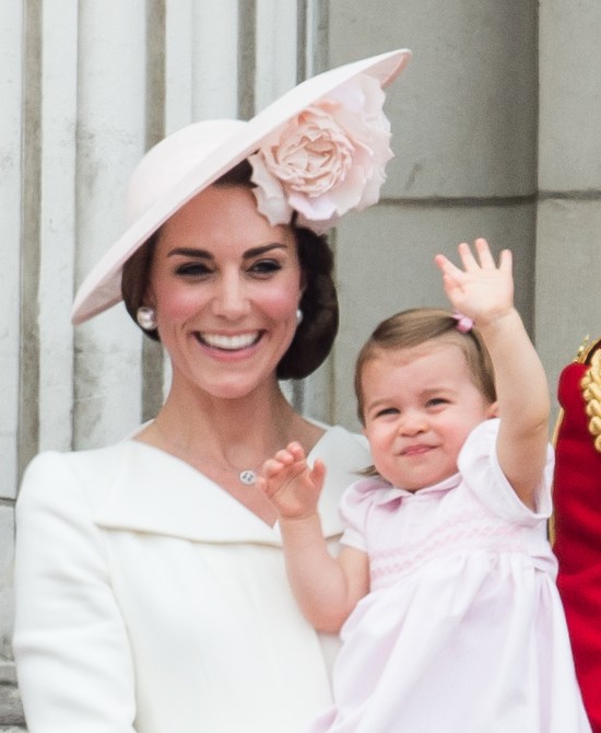 Catherine, Duchess of Cambridge, Princess Charlotte stand on the balcony during the Trooping the Colour, this year marking the Queen's official 90th birthday at The Mall on June 11, 2016 in London, England. The ceremony is Queen Elizabeth II's annual birthday parade and dates back to the time of Charles II in the 17th Century when the Colours of a regiment were used as a rallying point in battle.