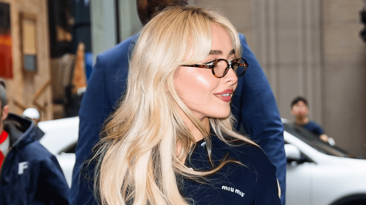 Sabrina Carpenter wearing oval tortoise shell glasses.