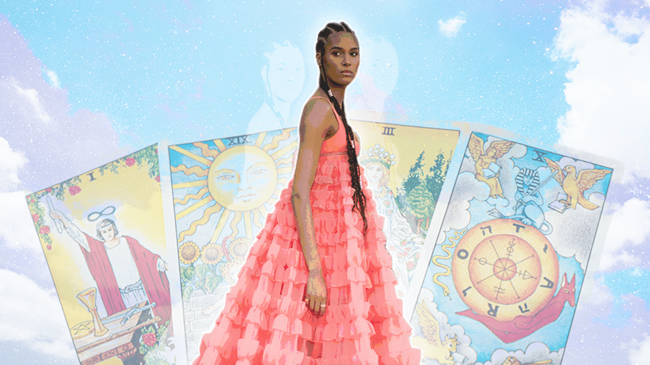 A woman standing in front of a deck of Tarot cards on a cloudy sky, in representation of your weekly tarot horoscope