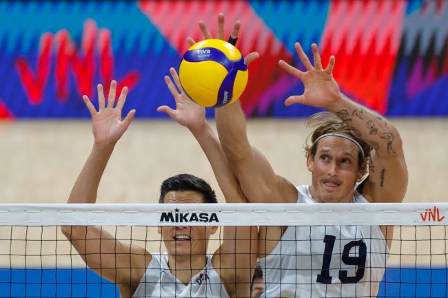 Taylor Averill of USA blocks the ball during the FIVB Men's Nations League game between Brazil and USA at SM Mall of Asia Arena on June 20, 2024 in Pasay, Luzon, Philippines.