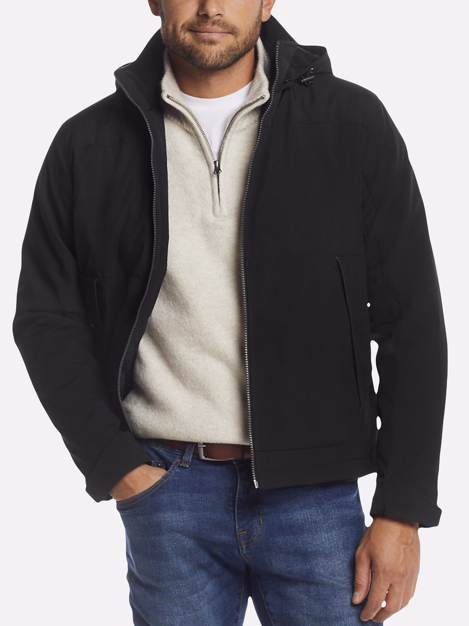 A model wearing a pair of black faux leather pants.