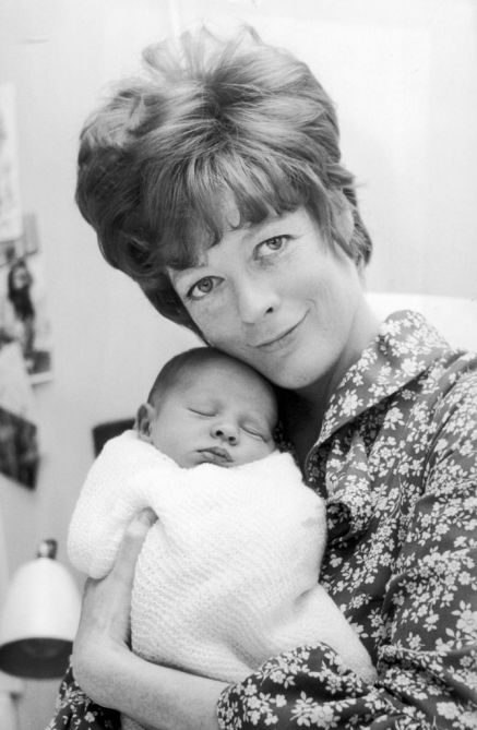 English actress Maggie Smith at the Middlesex Hospital with Toby, her baby son with actor husband Robert Stephens, 5th May 1969.