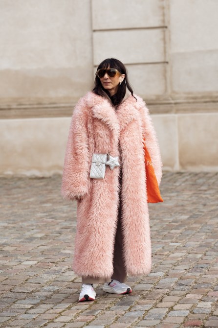 Susan Stjernberger is wearing a long pink fur coat