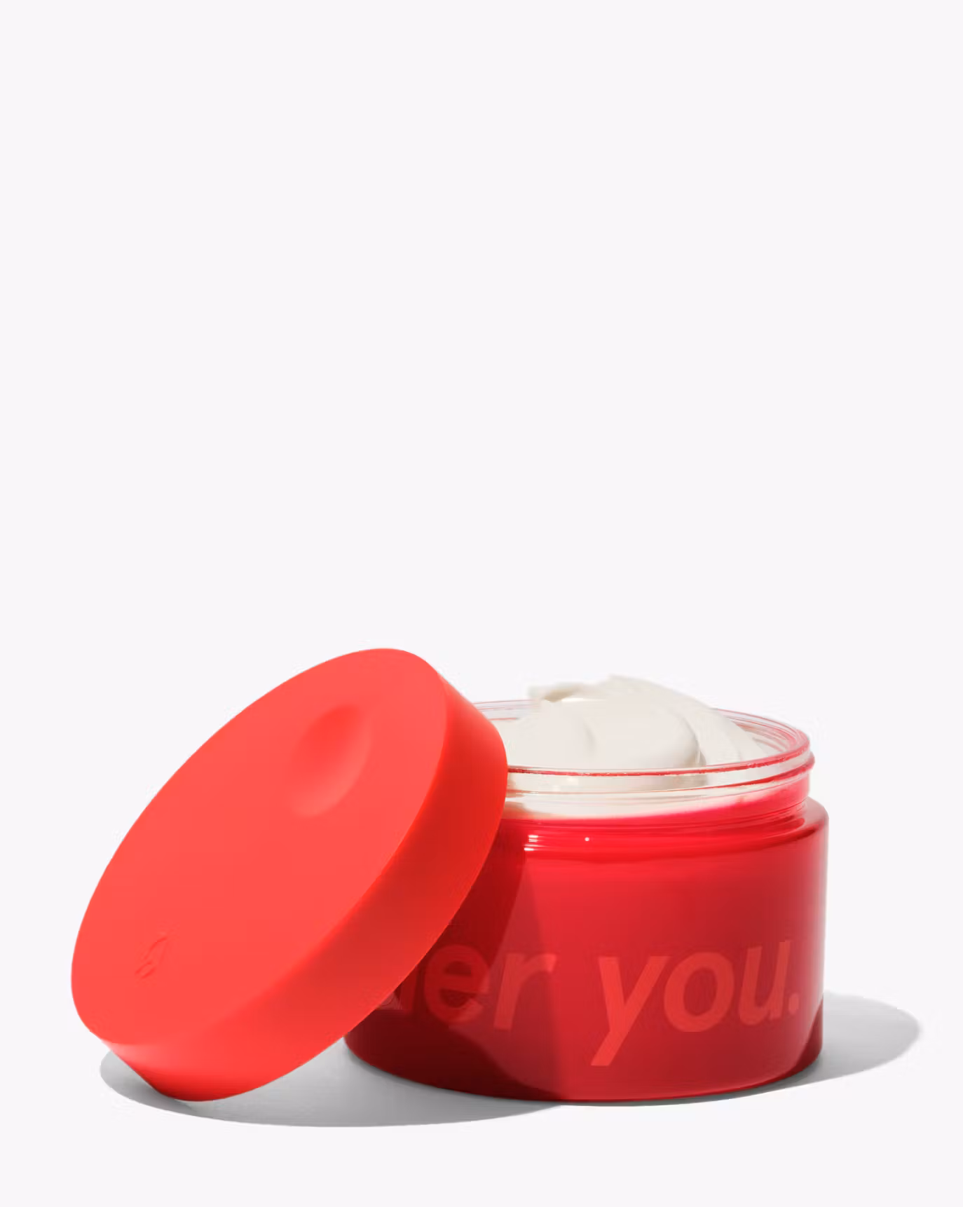 Crème de You in a red jar.