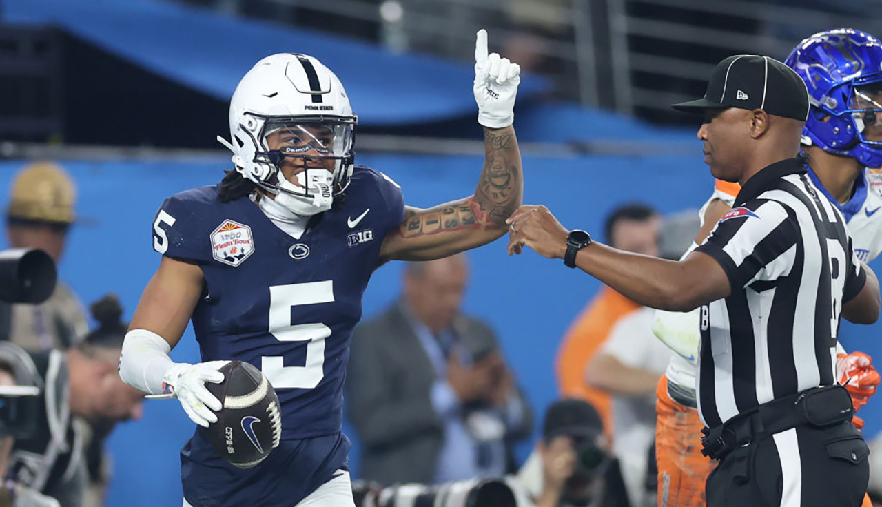 GLENDALE, ARIZONA - DECEMBER 31: Omari Evans #5 of the Penn State Nittany Lions celebrates after catching a pass for a touchdown during the first quarter against the Boise State Broncos in the 2024 Vrbo Fiesta Bowl at State Farm Stadium on December 31, 2024 in Glendale, Arizona. (Photo by Christian Petersen/Getty Images)
