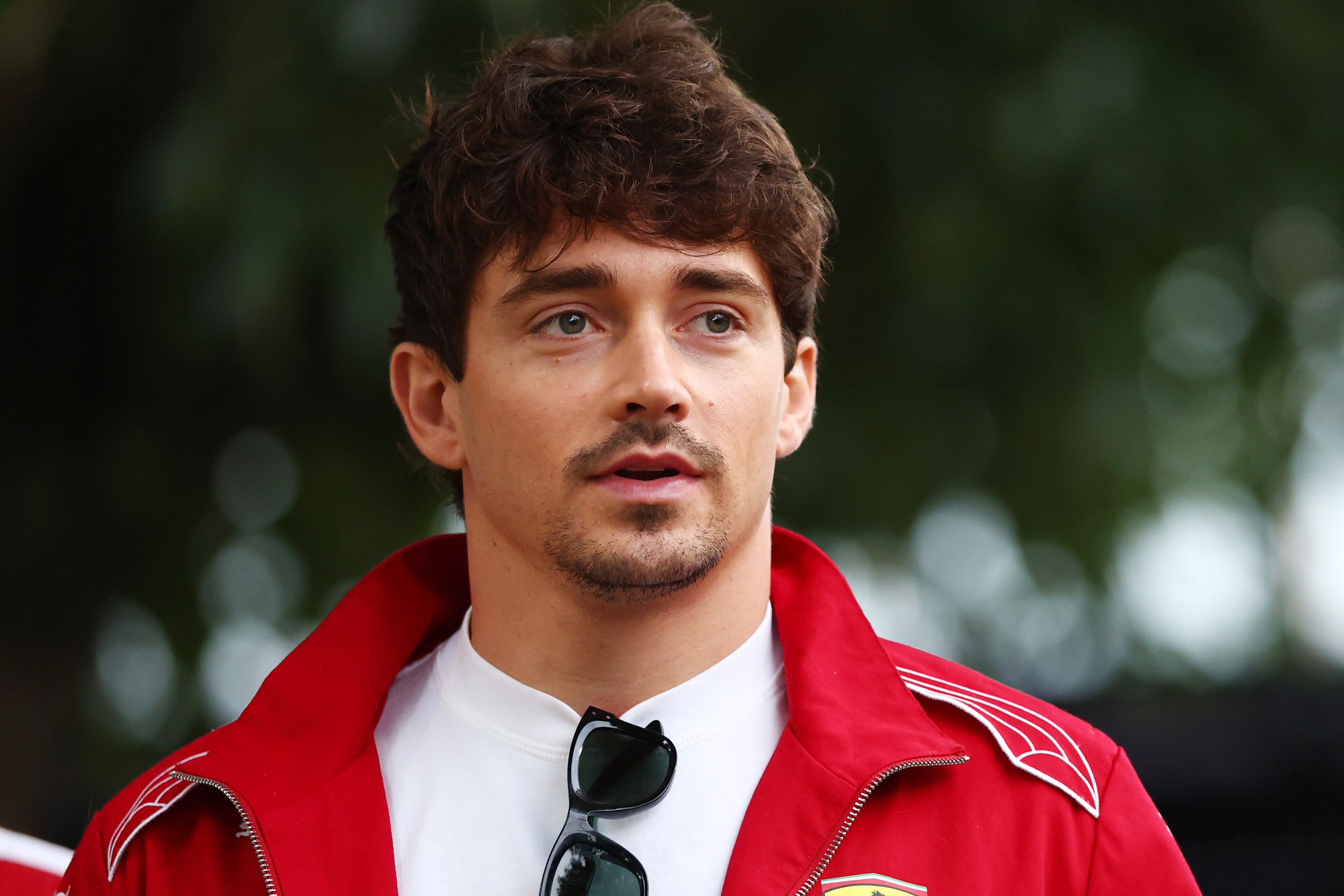 MELBOURNE, AUSTRALIA - MARCH 13: Charles Leclerc of Monaco and Scuderia Ferrari looks on in the Paddock during previews ahead of the F1 Grand Prix of Australia at Albert Park Grand Prix Circuit on March 13, 2025 in Melbourne, Australia.