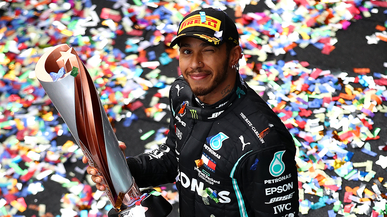 Race winner Lewis Hamilton of Great Britain and Mercedes GP celebrates winning a 7th F1 World Drivers Championship on the podium during the F1 Grand Prix of Turkey at Intercity Istanbul Park on November 15, 2020 in Istanbul, Turkey.