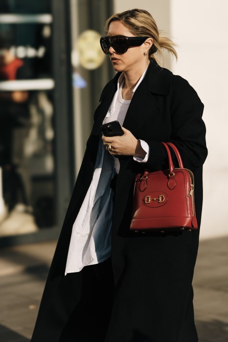 A fashion week guest wearing an updo.