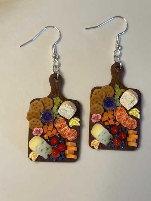 Earrings that resemble charcuterie boards.