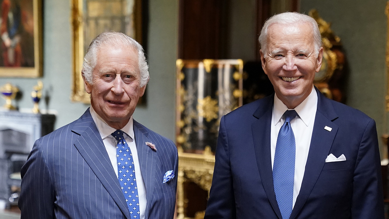 King Charles III and US President Joe Biden pose in the Grand Corridor at Windsor Castle on July 10, 2023 in Windsor, England. The President is visiting the UK to further strengthen the close relationship between the two nations and to discuss climate issues with King Charles III.