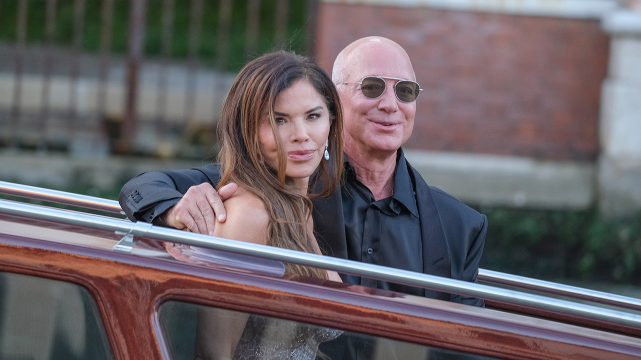 VENICE, ITALY - JUNE 28: Jeff Bezos and Lauren Sanchez are seen leaving the Aman Hotel for a party at the Arsenale on June 28, 2025 in Venice, Italy.
