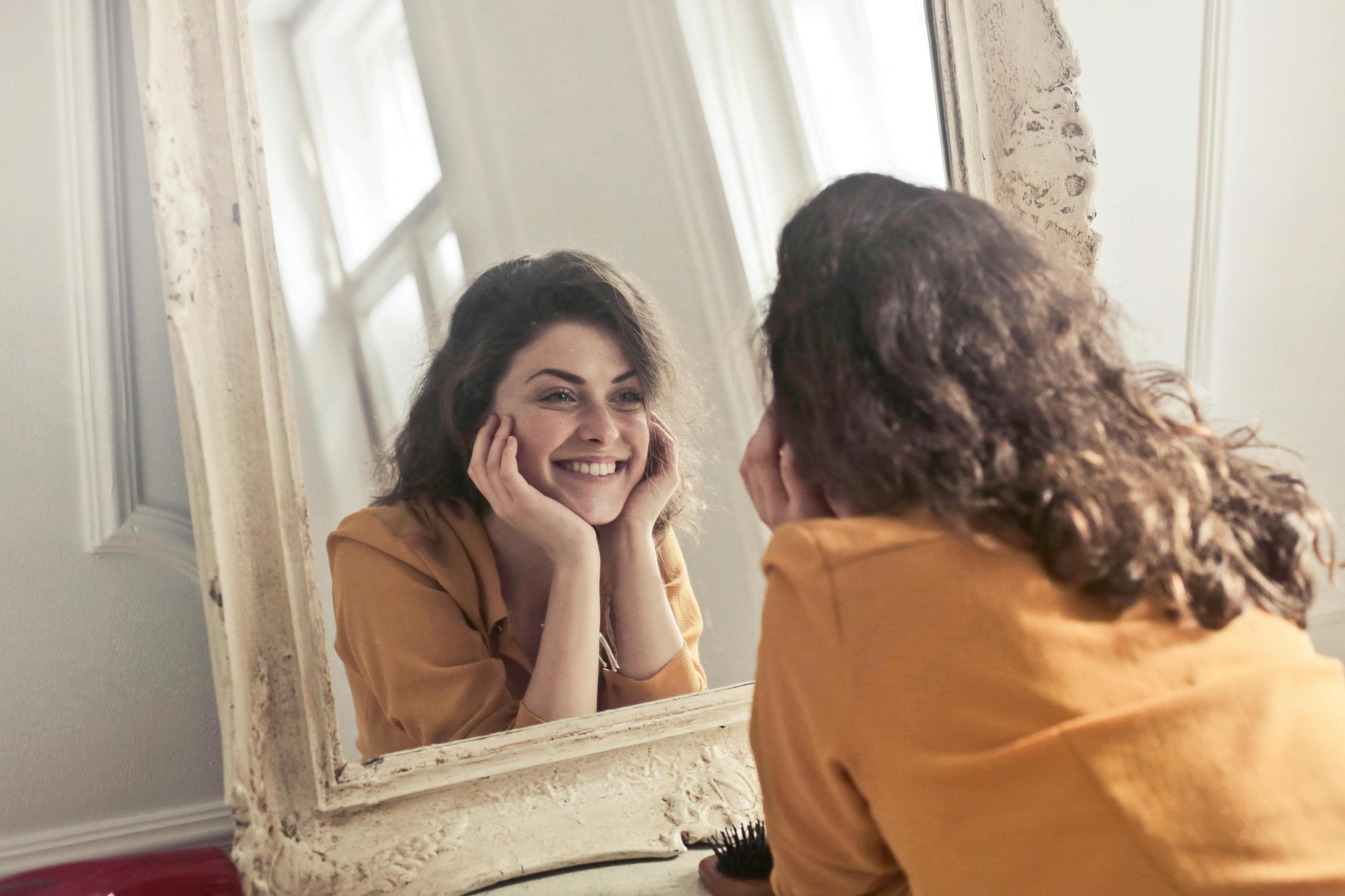 Woman smiling in mirror