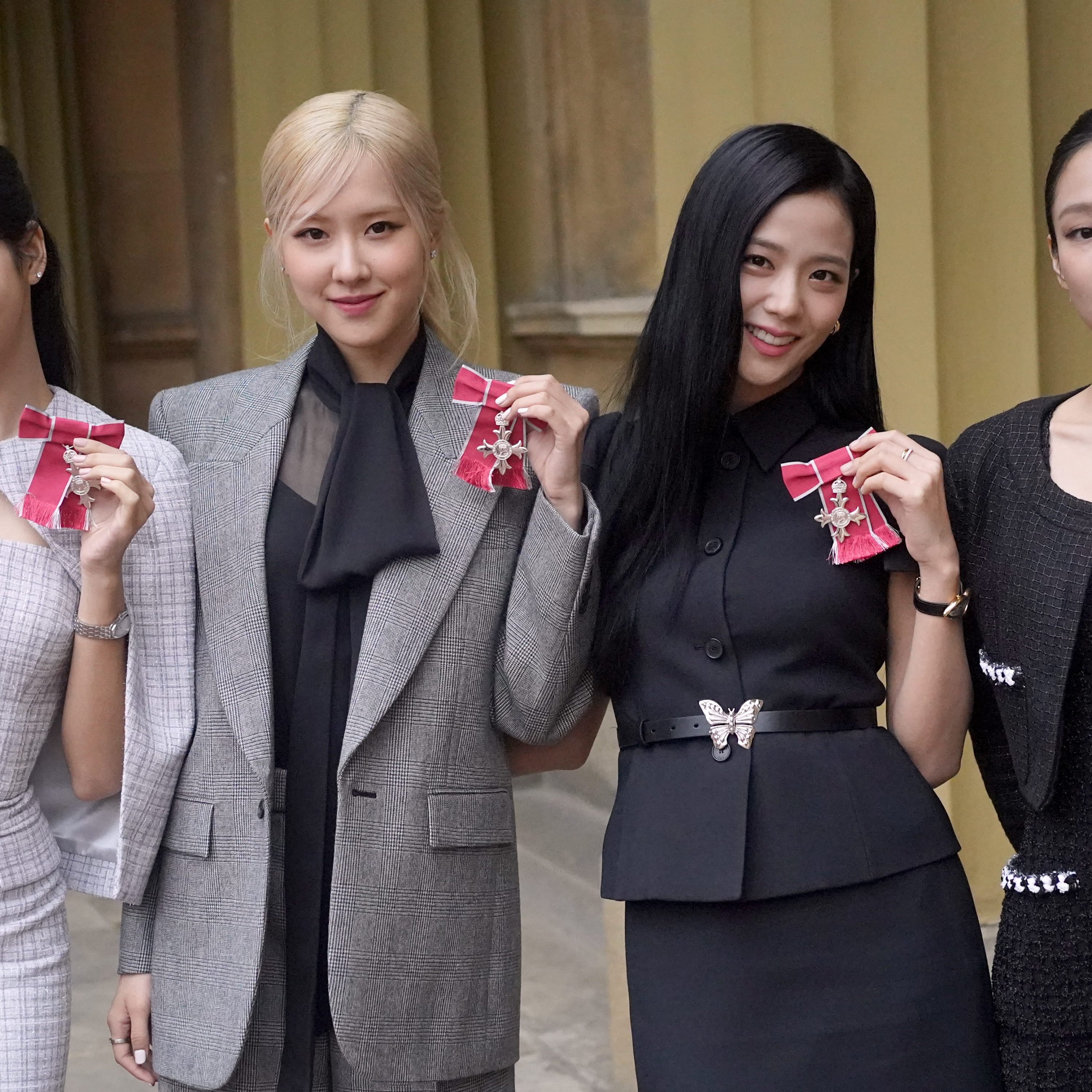 LONDON, ENGLAND - NOVEMBER 22: (left to right) Lisa (Lalisa Manoban), Rose (Roseanne Park), Jisoo Kim and Jennie Kim, from the K-Pop band Blackpink pose with their Honorary MBEs (Members of the Order of the British Empire), awarded to them in recognition of the band's role as COP26 advocates for the COP26 Summit in Glasgow 2021 on November 22, 2023 in London, England. King Charles III conducted the special Investiture ceremony in the presence of the President of South Korea, Yoon Suk Yeol, and his wife, Kim Keon Hee. (Photo by Victoria Jones - Pool/Getty Images)