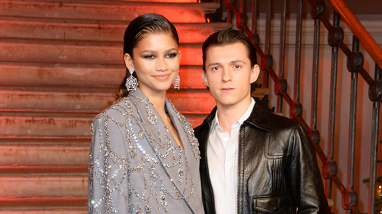 LONDON, ENGLAND - DECEMBER 05:  Zendaya and Tom Holland pose at a photocall for "Spider-Man: No Way Home" at The Old Sessions House on December 5, 2021 in London, England.